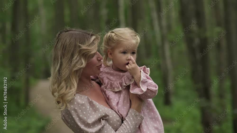 Imbued with the warm light of sunset, a mother and her little girl share an intimate embrace, encapsulating the essence of maternal love Imbued with the warm light of sunset, a mother and her little girl share an intimate embrace, encapsulating the essence of maternal love