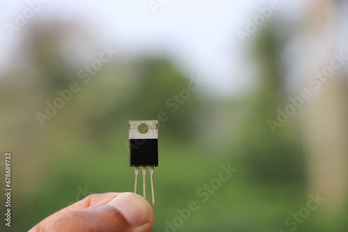 Power transistor which is used in electronic circuits held in the hand