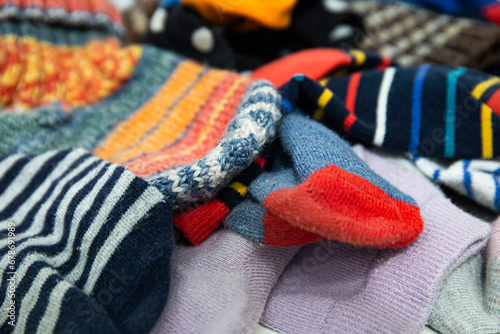Pile of mismatched colored socks. Funny close-up picture of some messy kid socks.