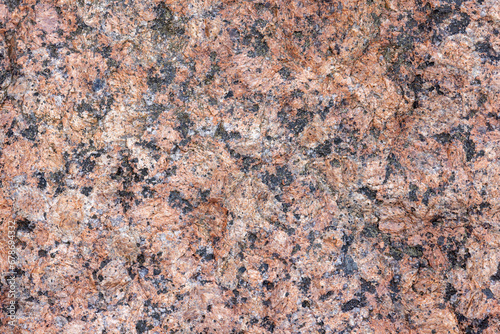 Natural red granite stone pattern, close up background texture