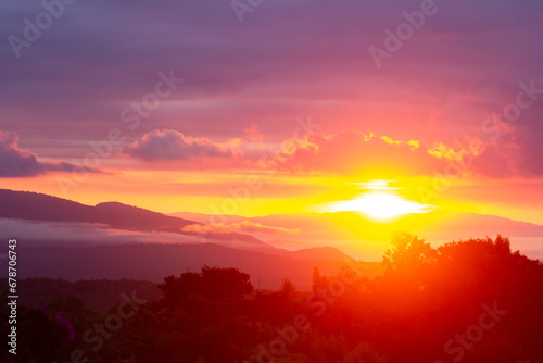 Amazing colorful sunrise over the rainforest mountains with fog and mist at Ob Luang natinoal park  Chiangmai  Thailand