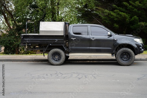 tradie truck with tools. tool box on the tray of a ute photo