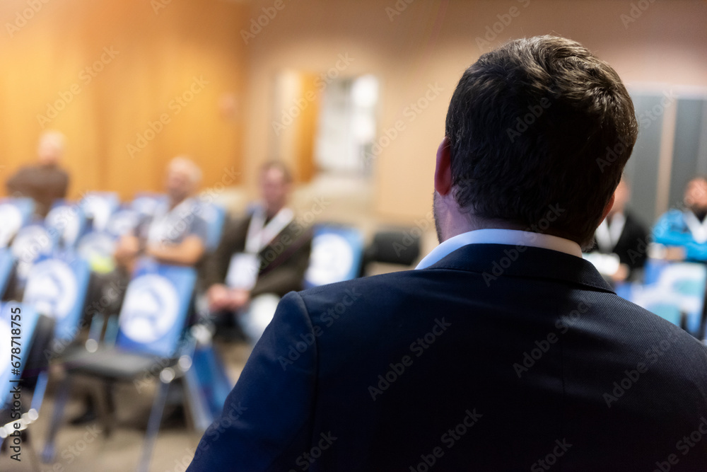 Male business coach speaker in suit give presentation, speaker presenter consulting training persuading employees client group - obrazy, fototapety, plakaty 
