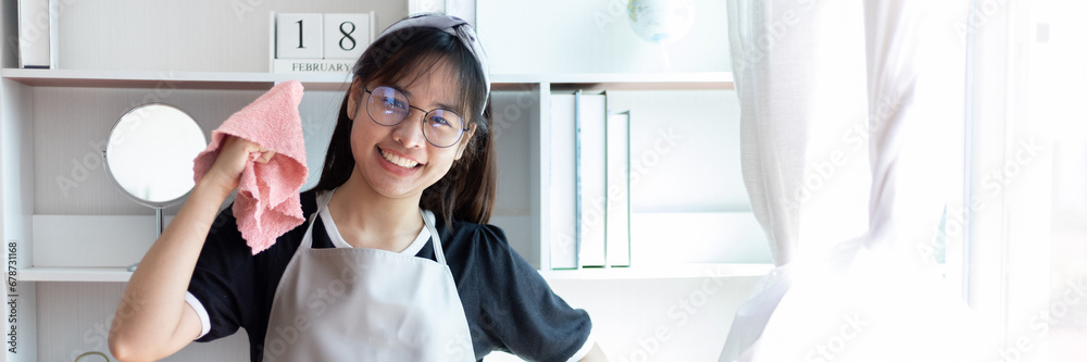 © Puwasit Inyavileart - Housewives use towels to wipe things, tables, chairs, display cabinets and glass inside the house, Big cleaning, Housework, Daily routine, Clean up on weekends. © Puwasit Inyavileart - Housewives use towels to wipe things, tables, chairs, display cabinets and glass inside the house, Big cleaning, Housework, Daily routine, Clean up on weekends.