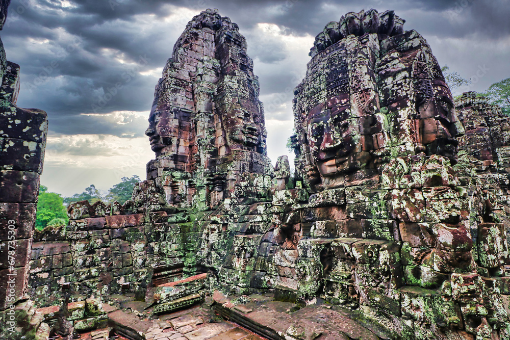 Naklejka premium Bayon Temple - Masterpiece of Khmer Architecture built as a Buddhist temple by Jayavarman VII with over 200 towering smiling and serene looking Buddha faces at Siem Reap, Cambodia, Asia