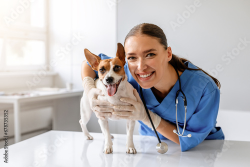 Female vet with happy dog photo