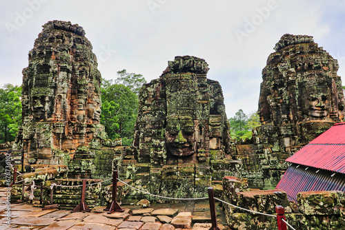 Bayon Temple - Masterpiece of Khmer Architecture built as a Buddhist temple by Jayavarman VII with over 200 towering smiling and serene looking Buddha faces at Siem Reap, Cambodia, Asia photo