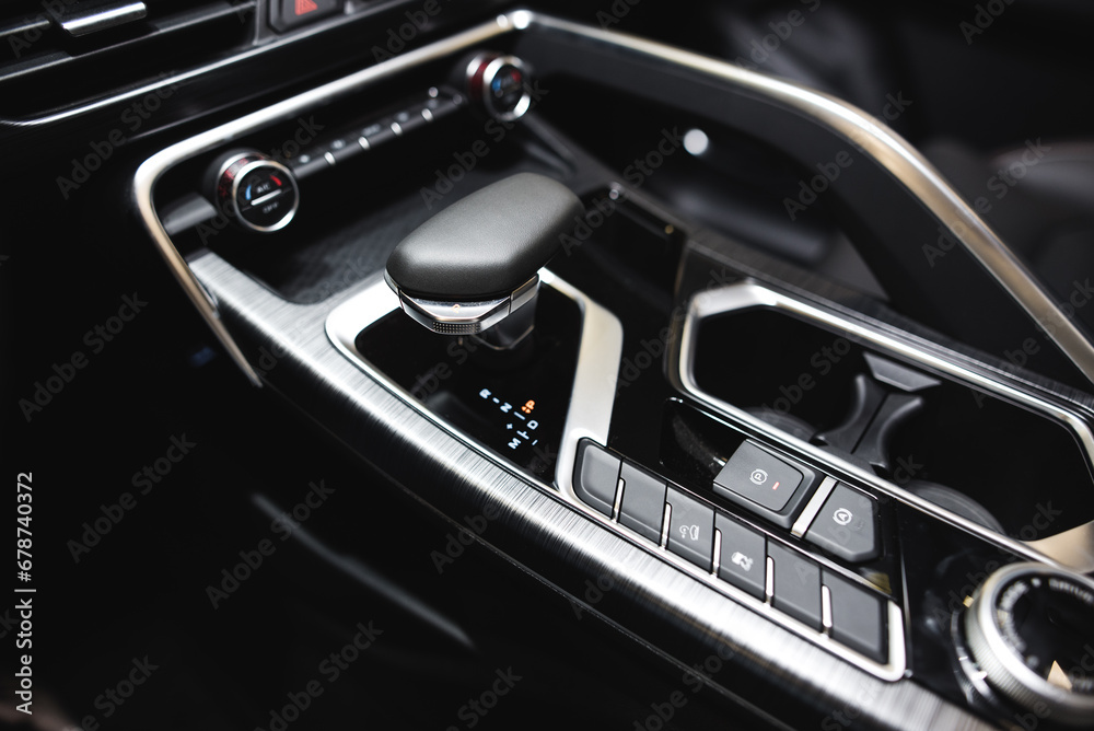 Detail of modern car interior, gear stick, automatic transmission in expensive car