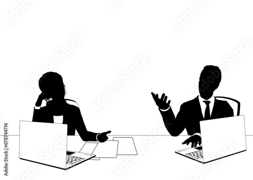 News anchor presenters or business people seated at a desk with laptops in silhouette