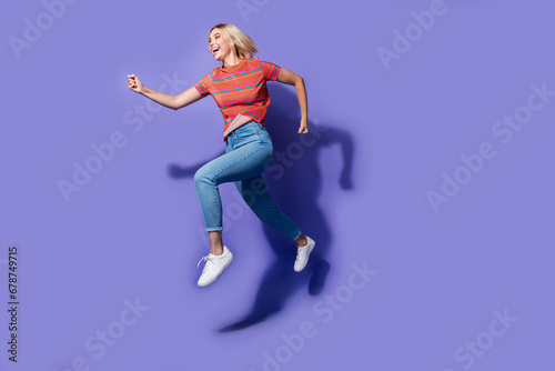 Full length size photo of running hurry up workaholic student wants to earn all the money in world isolated on purple color background