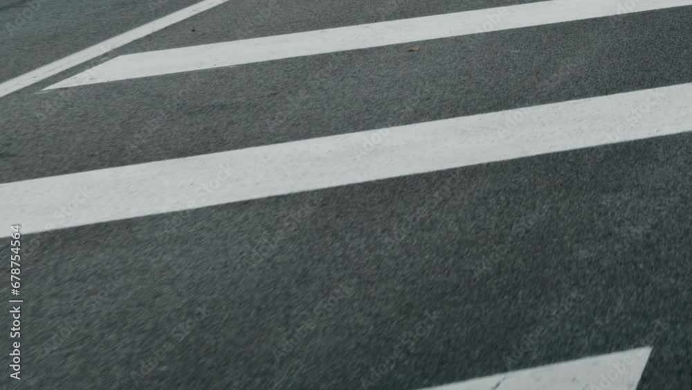 Road separation lines closeup on movement at asphalt on road trip Road separation lines closeup on movement at asphalt on road trip