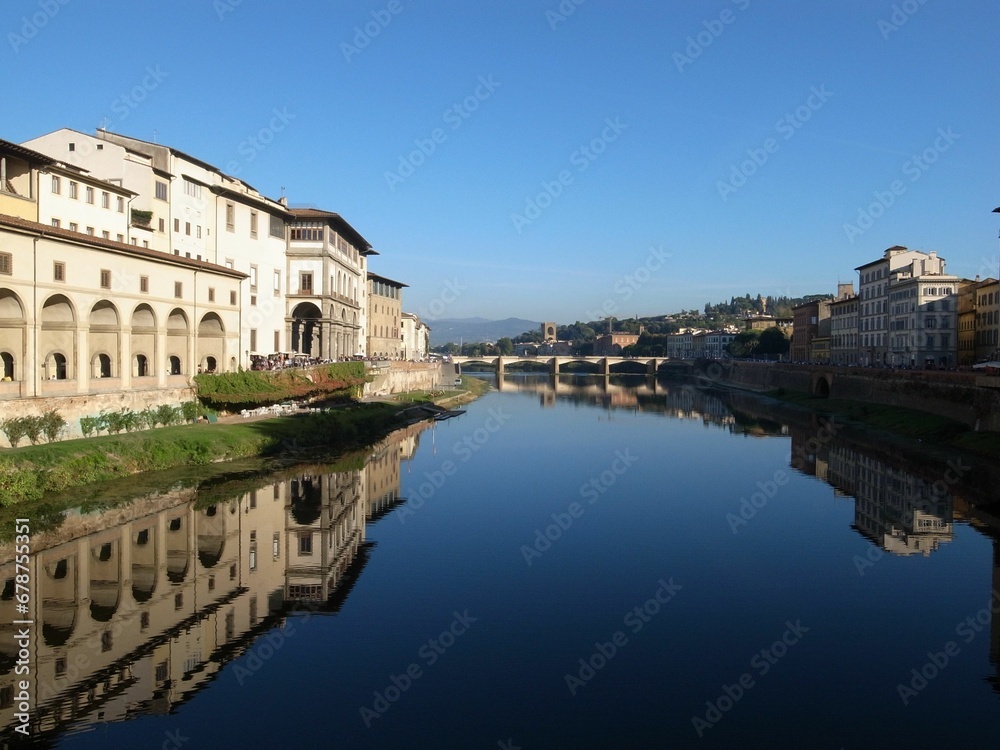 The Arno river, Ponte alle Grazie Bridge and old buildings in Florence, Italy