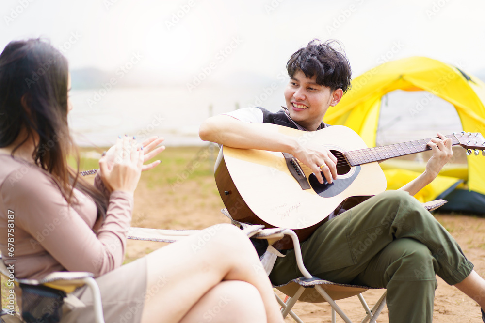 Asian couple enjoy camping together.