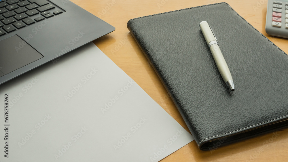 image with notebook, paper, pen and calculator on the table for background image with notebook, paper, pen and calculator on the table for background