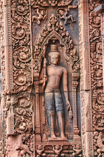 A Guardian diety bas relief at Banteay Srei Temple at Siem Reap, Cambodia, Asia