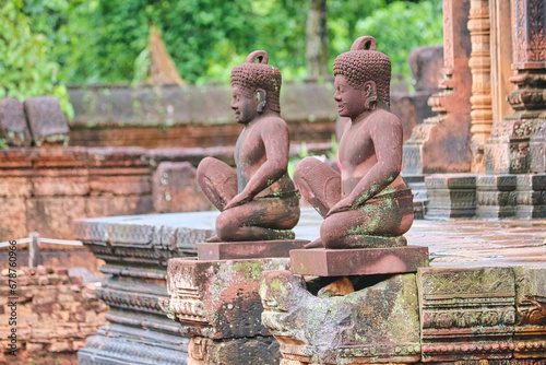 Divine Guardians statue from Hindu mythology at 10th Century Banteay Srei Temple at Siem Reap, Cambodia, Asia photo