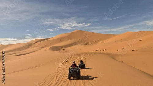 quad in the dunes of the sahara photo