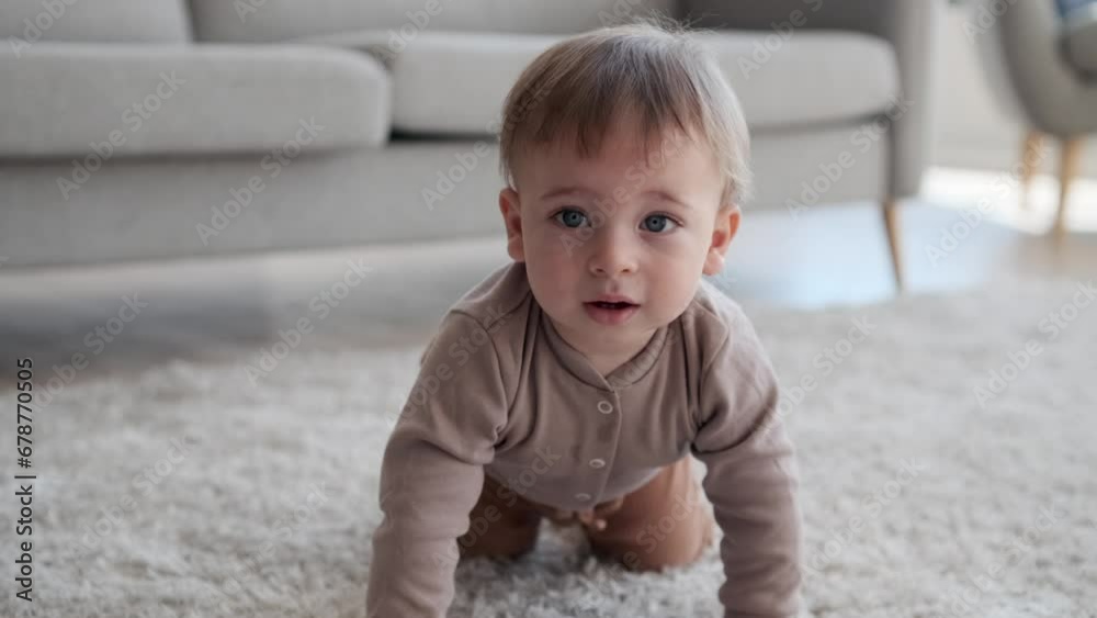 In the heart of the living room, a charming portrait captures a baby in the midst of crawling adventure. Their eyes are wide with curiosity, and the room echoes with gleeful babbles. In the heart of the living room, a charming portrait captures a baby in the midst of crawling adventure. Their eyes are wide with curiosity, and the room echoes with gleeful babbles.