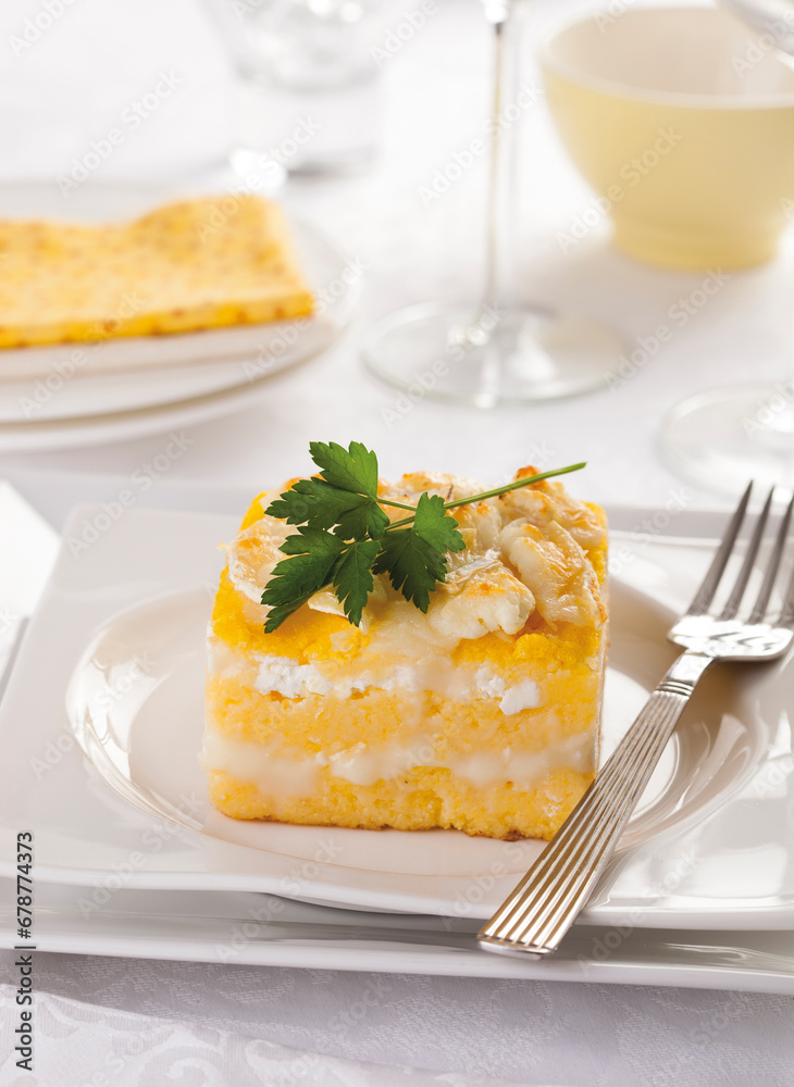 Corn porridge cooked in water and served with goat cheese and butter, a typical Romanian dish. Corn porridge cooked in water and served with goat cheese and butter, a typical Romanian dish.