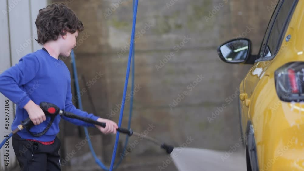 Elemental Child cleans the car with a pressure washer Elemental Child cleans the car with a pressure washer