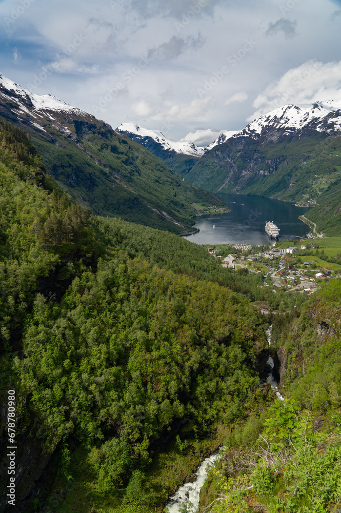 Beautiful view of the Geiranger Fjord and the town of Geiranger from the Adlerkehre with a cruise ship at anchor