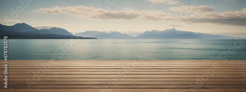 An empty wooden floor set amidst nature's beauty, showcasing a serene seascape and majestic mountain views for product montages.