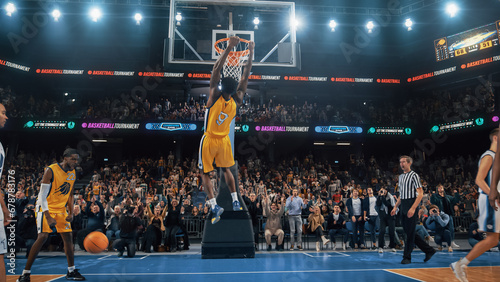 African American National Basketball Superstar Player Scoring a Powerful Slam Dunk Goal with Both Hands In Front Of Cheering Audience Of Fans. Cinematic Sports News Shot with Back View Action photo