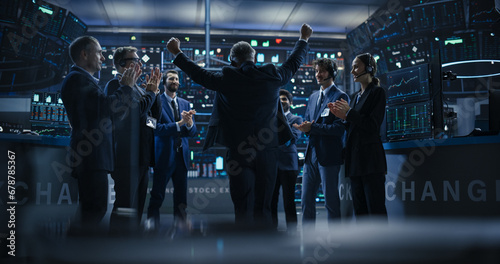 Team of Successful Stock Exchange Brokers Celebrating a Profitable Investment Bid on a Securities Market. Diverse Specialists and Asset Managers Clapping, Cheering, Shaking Hands with the Team Leader