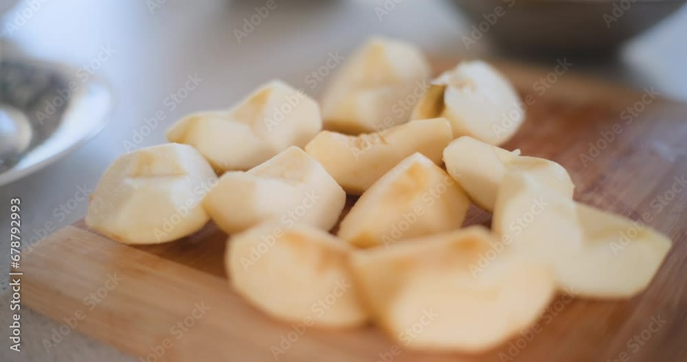 Peeled Apple Pieces Sliced Into Quarters On Table Peeled Apple Pieces Sliced Into Quarters On Table