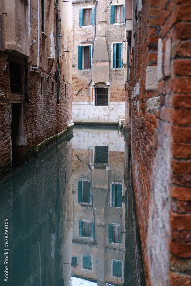 A view of some reflections in a small Canal. November 14th, 2023, Venice, Italy.