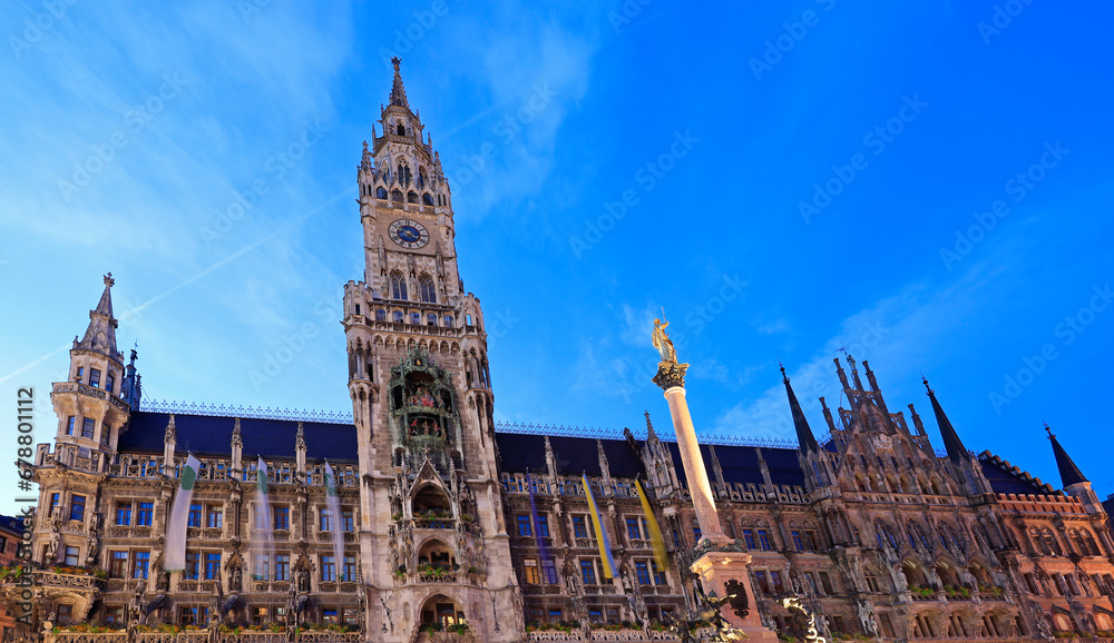 View on the main town hall with clock tower on Mary's square illuminated at dusk in Munich, Germany