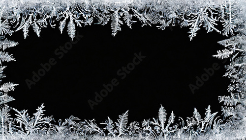 frostwork decorative frostwork ice crystals frame on black background can be used as window frost overlay in design photo