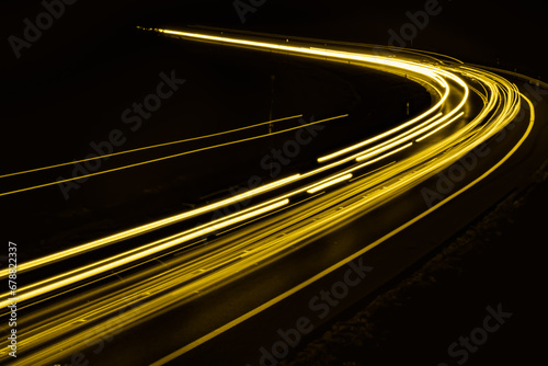 yellow car lights at night. long exposure photo