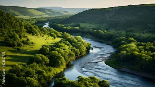 A winding river, with flourishing green banks as the background, during an early spring evening