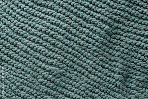 Close-up of teal textured fabric with a woven pattern