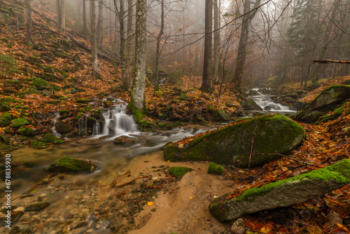 Ponikly waterfall with flood water after night rain in autumn morning photo