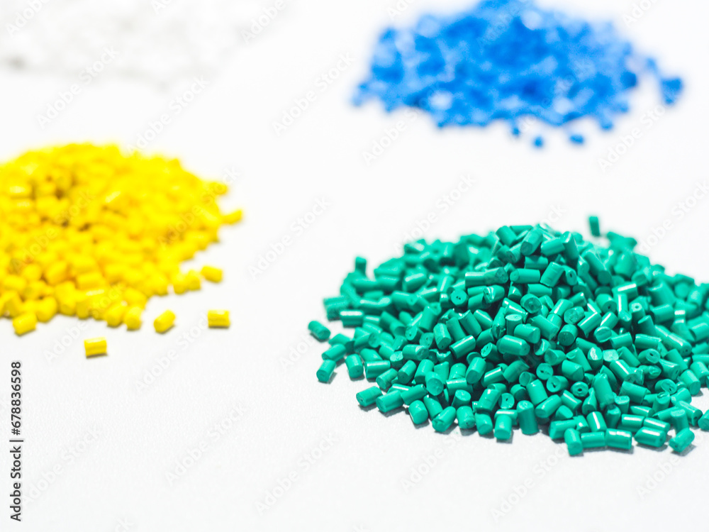 various colored masterbatch granules isolated on a white background, this polymer is a colorant for products in the plastics industry