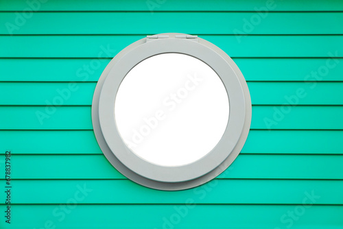 PVC ship round window frame on emerald green striped wall and transparent background