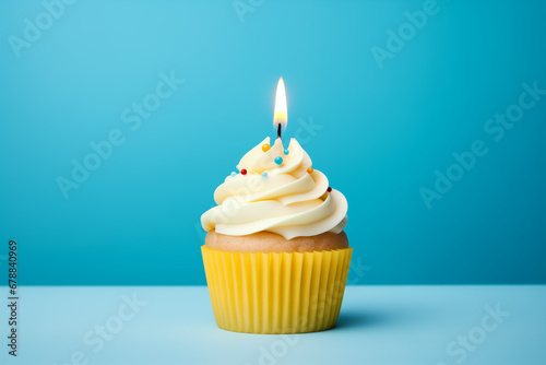 A cupcake with one candle on it.