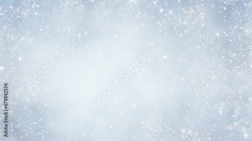 A soft blue background with a gentle snowfall effect, creating a magical atmosphere © artem