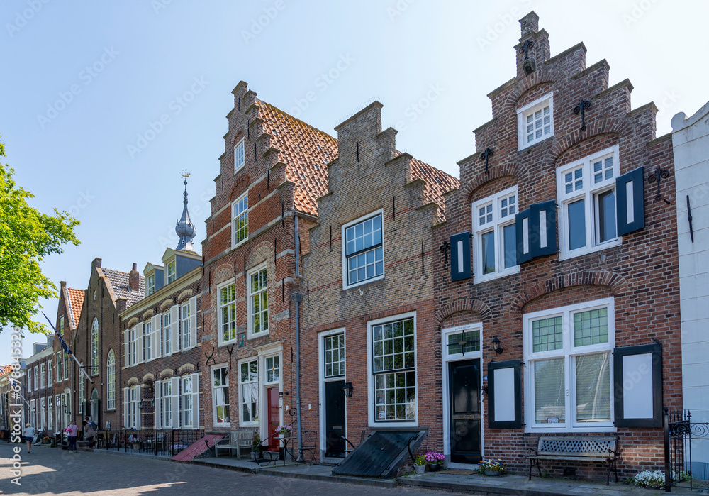 Beautiful old buildings with ornate facades on the Kaai in the historic town of Veere in Zeeland