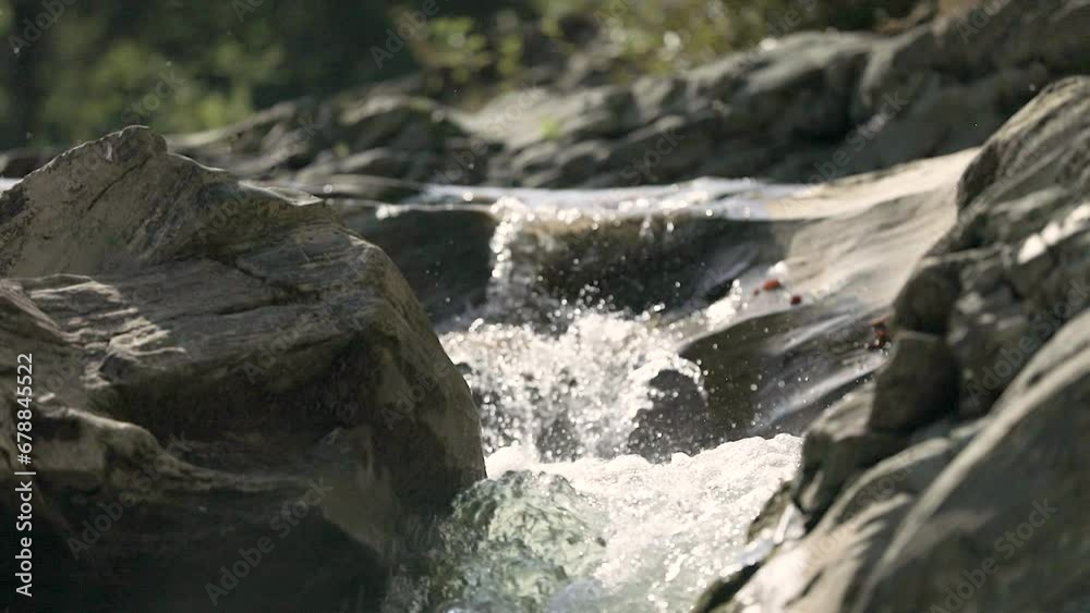 Mountain river flows through stones in the mountains Mountain river flows through stones in the mountains
