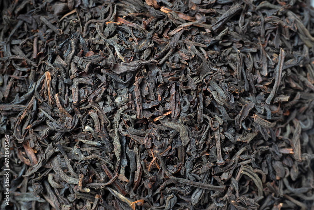Close-up of red tea leaves from China. Macro photo, top view, flat lay. Tea drinking tradition, food background Close-up of red tea leaves from China. Macro photo, top view, flat lay. Tea drinking tradition, food background