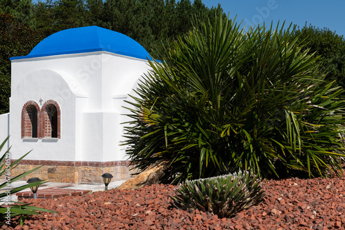 Lawsonville, NC / USA - September 16, 2023: Landscaping with chapel building at Panagia Pammakaristos Greek Orthodox Monastery. photo