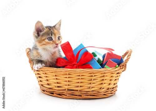 Red kitten in a basket with gifts. © ANASTASIIA