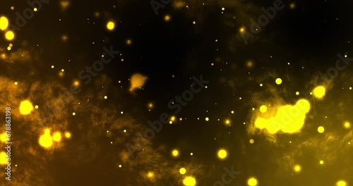 Abstract smoky background with bright glowing glitter bokeh particles creating an illusion of clouds or outer space. Glowing luxury award animation background in yellow color. photo