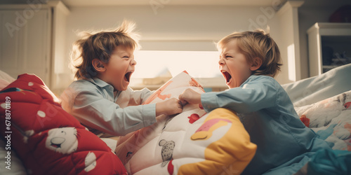 Slika na platnu Siblings having fight with pillows at home