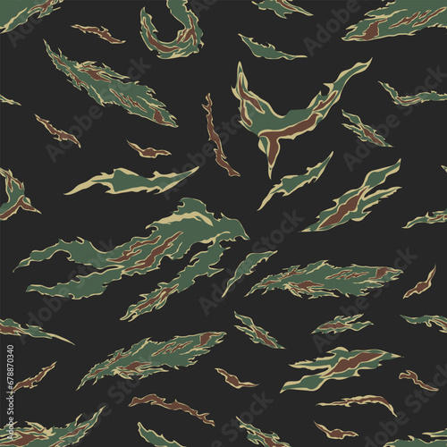 Seamless pattern green camouflage reed leaves for fabrics.