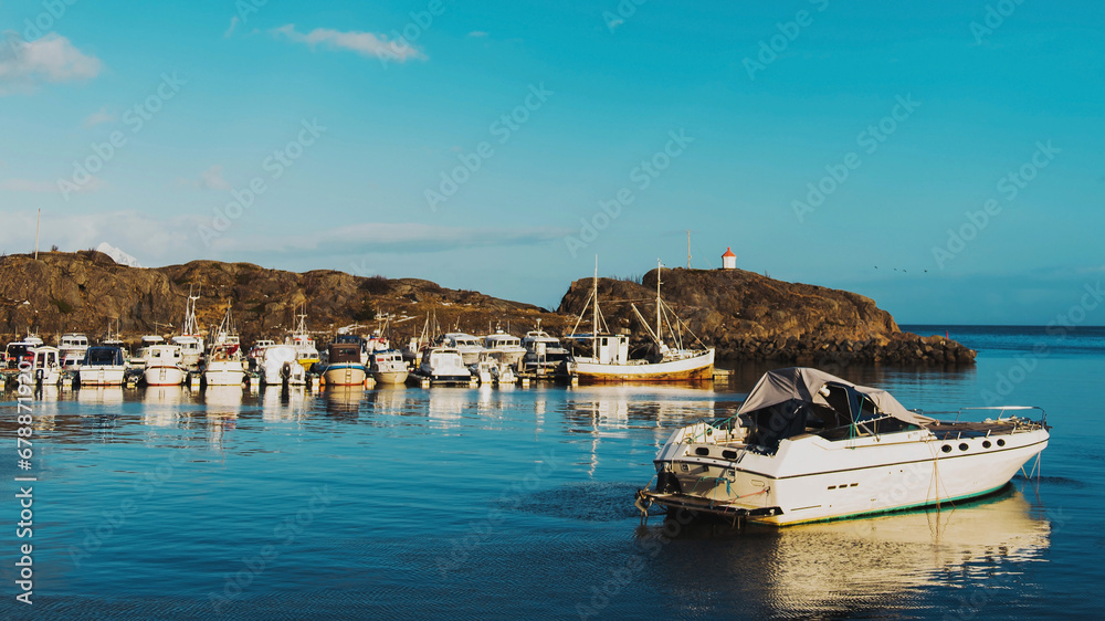 Norwegian sea coast with many fishing boats on berth