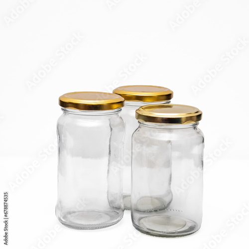 Three empty jars on somewhat gray white background